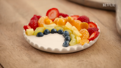 Meghan, the Duchess of Sussex, shows how to make a rainbow fruit salad on the set of With Love, Meghan.