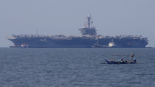 The USS Carl Vinson aircraft carrier at anchor off Manila, Philippines. (AAP)