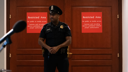A US Capitol Police officer stands at the entrance to a secure area during closed-door interviews with Kurt Volker, a former special envoy to Ukraine, as House Democrats proceed with the impeachment investigation of President Donald Trump.
