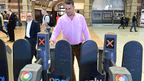 New South Wales Transport Minister Andrew Constance demonstrates the contactless payment option. (AAP)