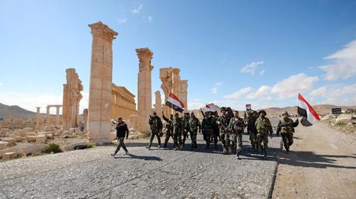 Syrian Army soldiers liberated Palmyra from ISIL on Sunday. (AAP)