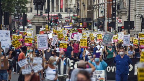 Healthcare workers take part in a protest over pay conditions in the NHS on August 8, 2020 in London, United Kingdom