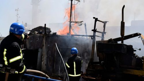 Firefighters put out a fire in the port after a Russian missiles attack in Odesa