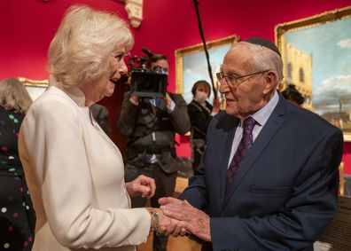 Camilla, Duchess of Cornwall with Holocaust survivor Manfred Goldberg at an exhibition of Seven Portraits: Surviving the Holocaust, which were commissioned by Prince Charles, Prince of Wales to pay tribute to Holocaust survivors, at The Queens Gallery, Buckingham Palace on January 24, 2022 in London, England. (Photo by Arthur Edwards - WPA Pool/Getty Images)