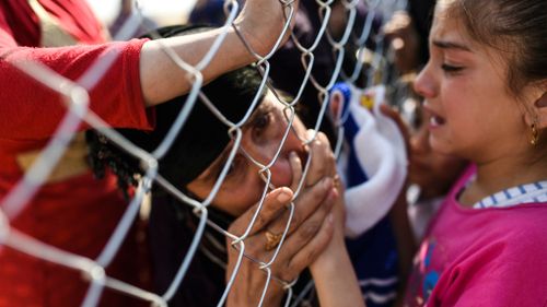 Some families who fled Mosul have been reunited with relatives who came to a refugee camp in the Khazir area in previous years. (AFP)