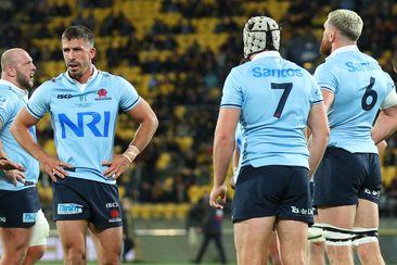 Jake Gordon of the Waratahs looks dejected during the round 11 Super Rugby Pacific match between Hurricanes and NSW Waratahs.