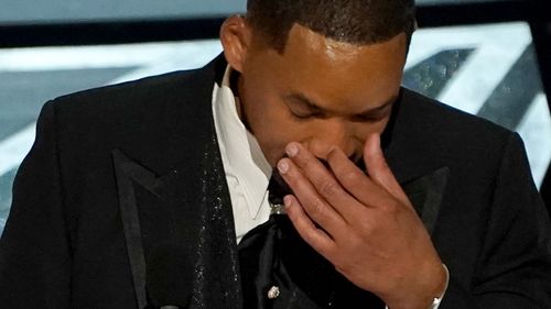 Will Smith cries as he accepts the award for best performance by an actor in a leading role for "King Richard" at the Oscars