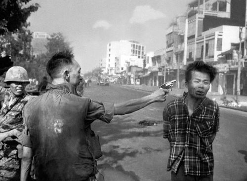 South Vietnamese Gen. Nguyen Ngoc Loan, chief of the national police, fires his pistol, shoots, executes into the head of suspected Viet Cong officer Nguyen Van Lem (also known as Bay Lop) on a Saigon street Feb. 1, 1968, early in the Tet Offensive. (AAP)