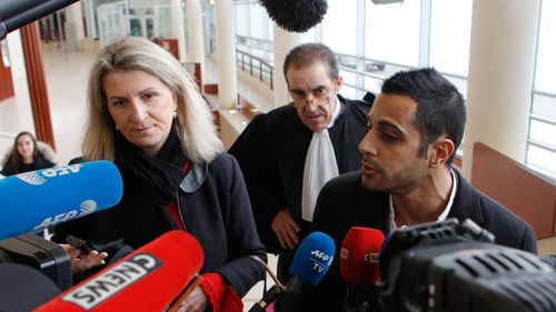 Lawyers for the suspect Marc Goudarzian and Sandrine Parise-Heideiger, left, answer reporters at the hall of justice Tuesday, Feb.13, 2018 in Pontoise, outside Paris. A 29-year-old man is set to appear in a French court Tuesday for having sex with an 11-year-old girl last year, in a trial that has rekindled debate on the age of sexual consent in France. In a decision that shocked many, the prosecutor's office in the Paris suburb of Pontoise decided to send the man to trial on charges of "sexual abuse of a minor under 15 years old," and not rape. (AP Photo/Francois Mori) 