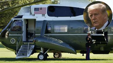 A pilot of Marine One wears a face mask as President Donald Trump prepares to leave the White House to go to Walter Reed National Military Medical Center after he tested positive for COVID-19, Friday, Oct. 2, 2020, in Washington. (AP Photo/Alex Brandon)