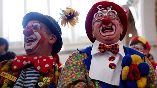 Clowns dressed in full costume attend a service in memory of celebrated clown Joseph Grimaldi at a church in Dalston, East London on February 2, 2014. (ANDREW COWIE/AFP/Getty Images) 