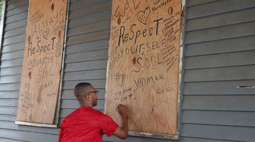 A fan leaves flowers and expresses his love at the home where Aretha Louise Franklin was born on March 25, 1942 in Memphis.