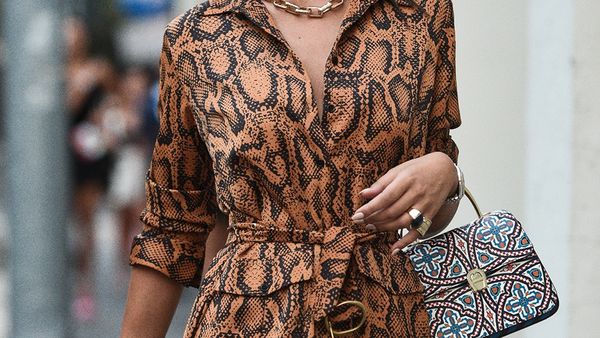 Stylish woman wearing dress and handbag