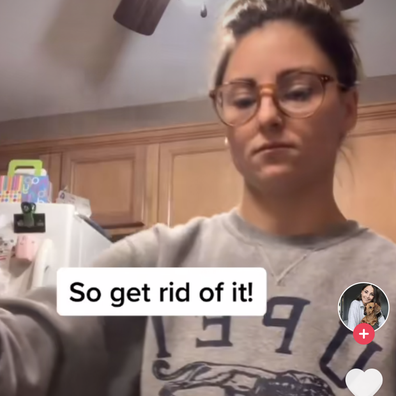 Woman washes cooked meat