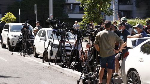 Media outside the Park Hotel in Melbourne, where Serbian tennis player Novak Djokovic was confined.
