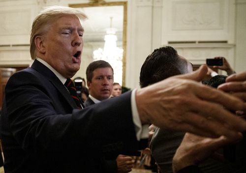 President Donald Trump greets people in the audience at the Hispanic Heritage Month Reception in the East Room of the White House in Washington, September 27, 2019