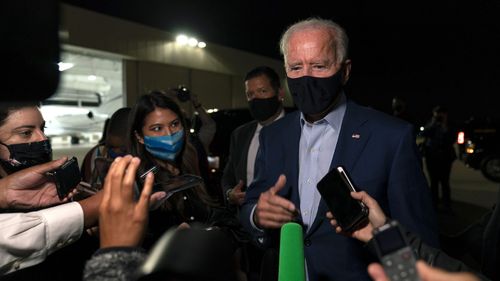 Joe Biden answers questions from reporters at New Castle Airport in Delaware.