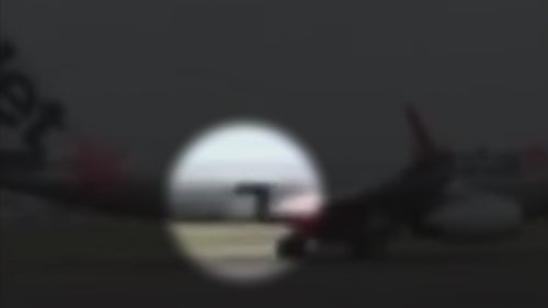 Footage shows the moment a Jetstar flight began taxiing with a cargo door wide open.