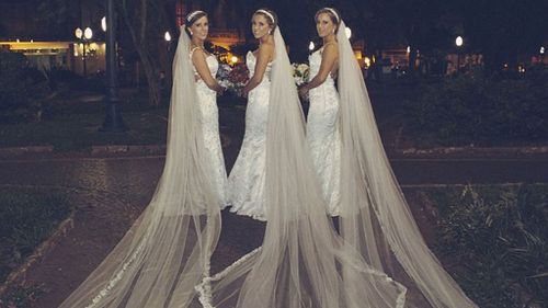 The brides wore the same dresses for their wedding day. (Everton Rose Associates)