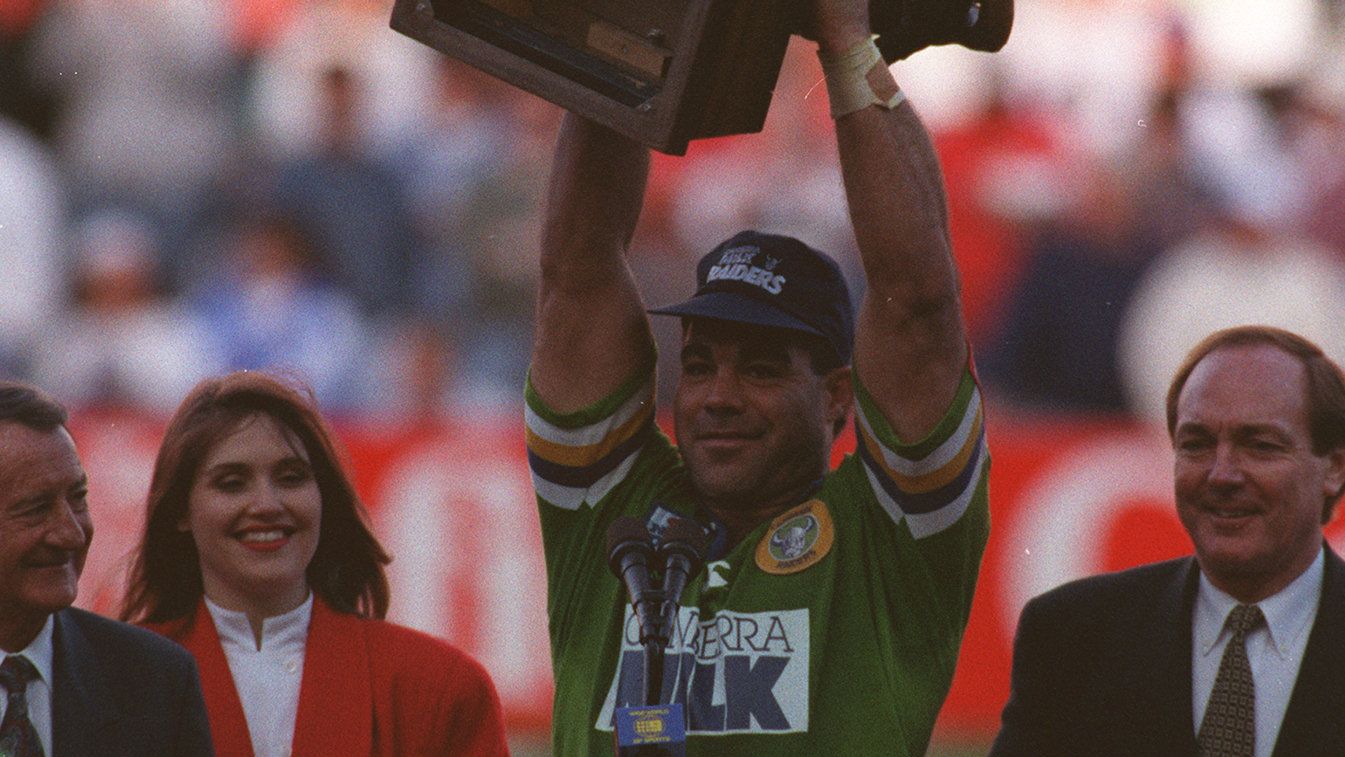 Mal Meninga holds up the 1994 Winfield Cup trophy in his Canberra Milk jersey.