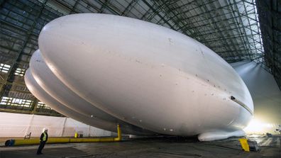 <p>The world’s largest aircraft
will soon take to the air for the first time.</p><p>The Airlander 10 is 92m long and
can carry up to 10 tonnes.</p><p>The giant construction is helium-filled to help keep
it in the air.</p><p><strong>Click through for more photos of the incredible
aircraft.</strong></p>