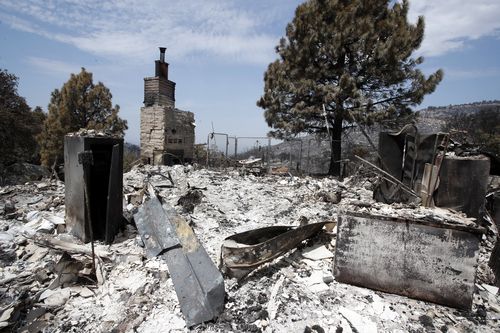 Residents are not yet being allowed back to fire-ravaged areas. Picture: AP