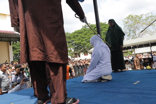 World News: Indonesian teenage couple caned for public affection