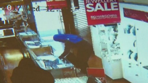 Masked men stormed the Elsternwick shop, smashing the cabinets with hammers. (9NEWS)