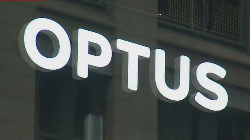 A close-up shot of an Optus store sign