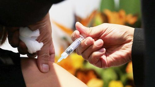 Member for Chisholm Julia Banks receives a flu shot. Picture: AAP