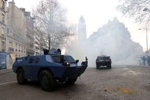 A dozen tanks rolled through the streets of the capital, a show of force the military hoped would keep protestors back. 