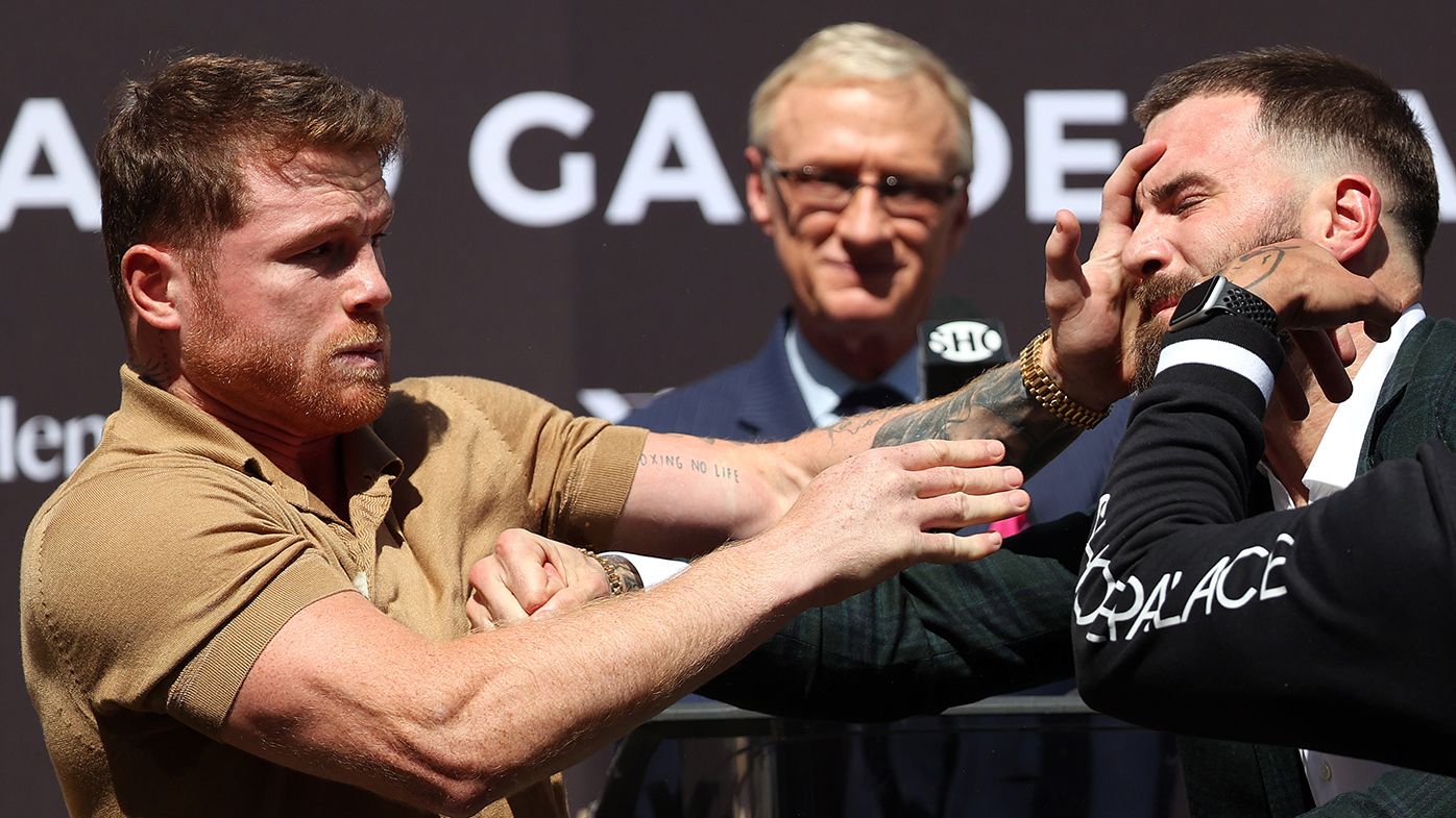 Canelo Alvarez slaps Caleb Plant during a face-off before a press conference ahead of their super middleweight fight on November 6.
