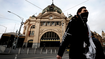 A man is seen wearing a face mask out Flinders Street Station on July 23, 2020 in Melbourne, Australia. Face masks or face coverings are now mandatory for anyone leaving their homes in the Melbourne metropolitan area or the Mitchell Shire.