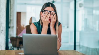 Woman stressed at work.