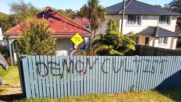 The graffiti spray painted on Nathalie Gits&#x27; front fence in response to her climate sign.