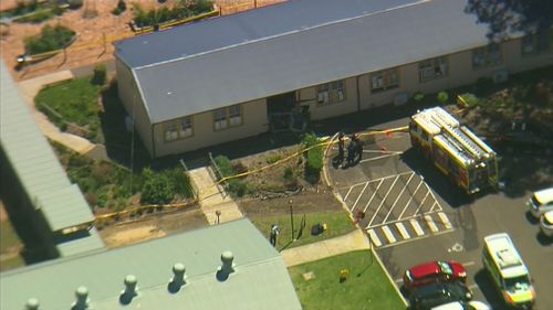 The female driver crashed into the classroom after she was distracted by something in her car, police said. (9NEWS)