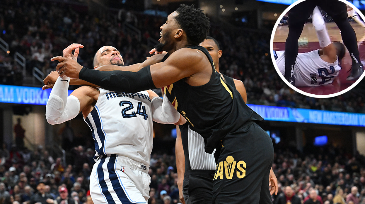 Dillon Brooks of the Memphis Grizzlies fights with Donovan Mitchell of the Cleveland Cavaliers.