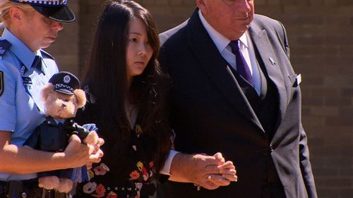 Mr Proctor’s wife Dianne, who is pregnant with the couple’s first child, carried a teddy in a police outfit into the church.

