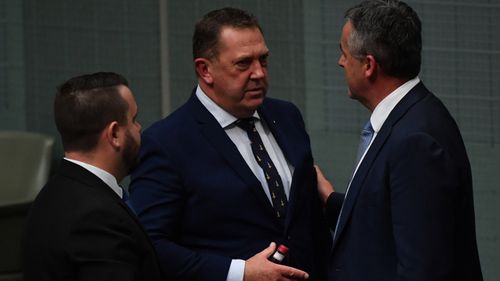 Member for Braddon Gavin Pearce (centre) and Minister for Veterans Affairs Darren Chester (right) following debate on a Royal Commission into Veteran Suicides in the House of Representatives.