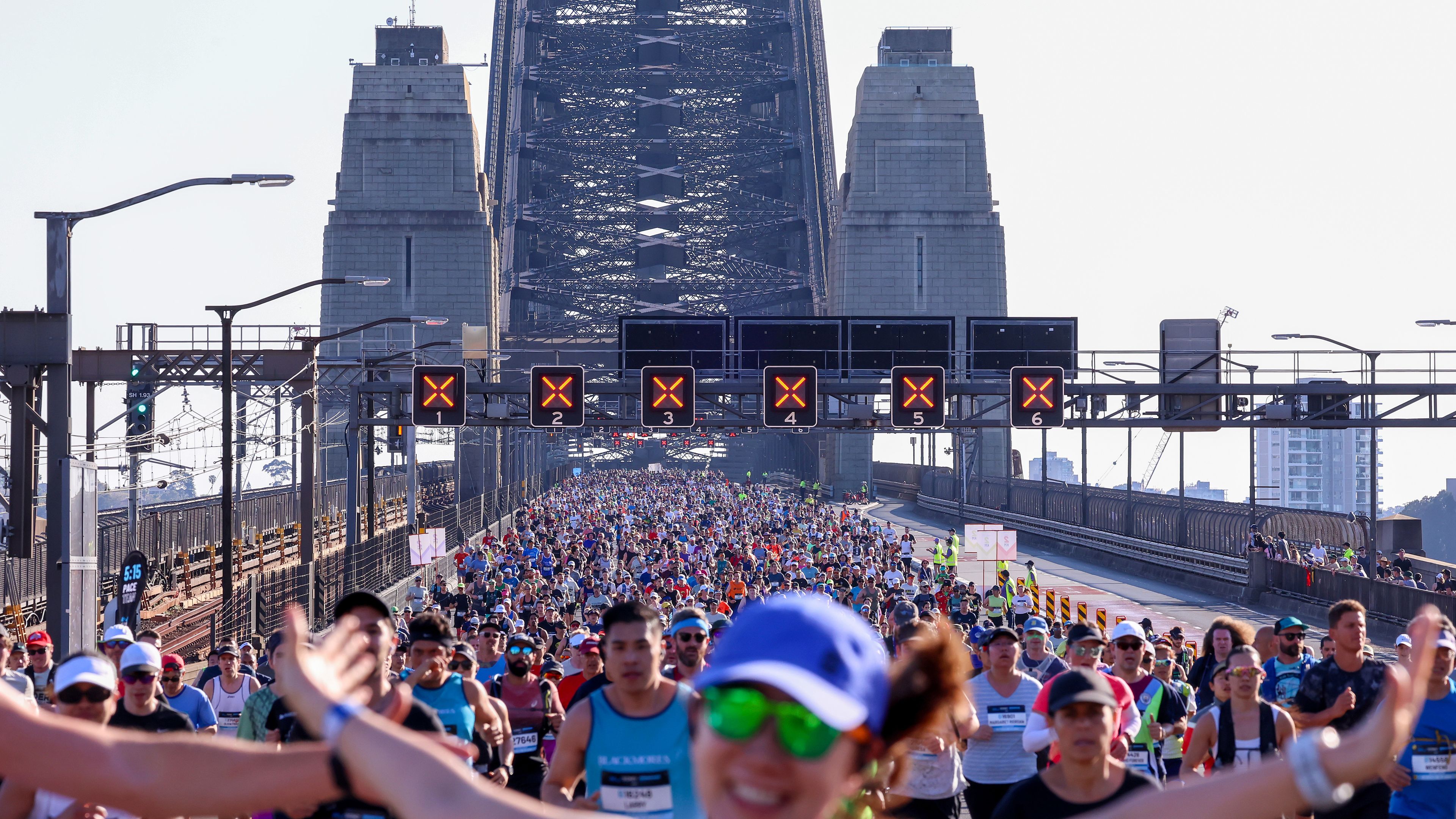 Participants of the Sydney Marathon crossing the Sydney Harbour Bridge.