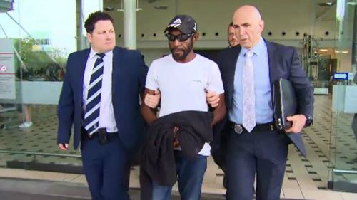 The man was arrested at Brisbane International Airport this morning. Picture: 9NEWS