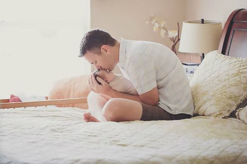 Stephen cradles Abigail. (Mary Huszcza/8.08 Photography)