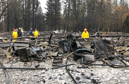 Crews planned to resume the grim task today after working on-and-off the day before amid a downpour in the devastated town of Paradise. 