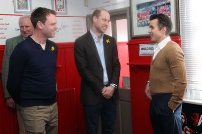 Prince William, Prince of Wales (C) and Chairman of Wrexham AFC Rob McElhenney (R) 