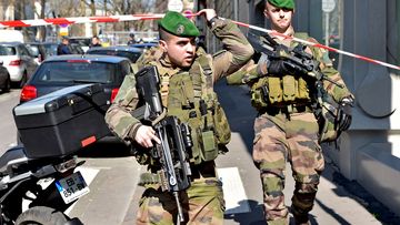 French Army soldiers arrive at the scene of the Paris offices of the International Monetary Fund. (AFP)