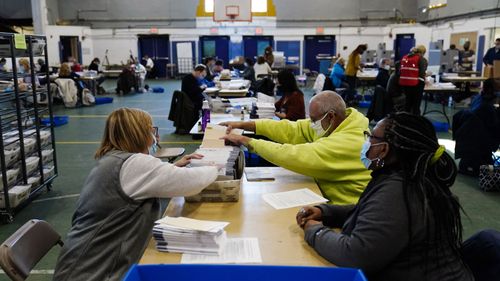 Chester County election workers process mail-in and absentee ballots for the 2020 general election in the United States at West Chester University, Wednesday, Nov. 4, 2020, in West Chester, Pa