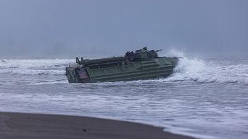 Taiwan&#x27;s AAV7 amphibious assault vehicle departs from a beach during an amphibious landing drill on May 24, 2023 in Yilan, Taiwan. 