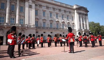 The Welsh Guards Band led by Band Major, Major Petritz-Watts, the first female leader of the guards band, perform 'Sweet Caroline' and 'Waltzing Matilda' at Buckingham Palace London, during the FIFA Women's World Cup semi-final between Australia and England.