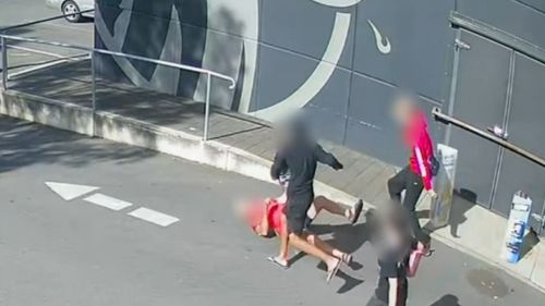 An Adelaide bottle shop was the scene of a violent robbery yesterday, resulting in injuries to both a 75-year-old customer and a 22-year-old staff member. 