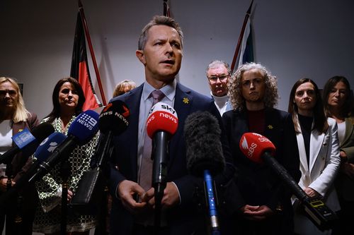 Federal Minister for Education Jason Clare alongside state education ministers during a press conference regarding early childcare.